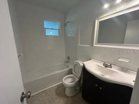 a view of a refrigerator in kitchen and a sink