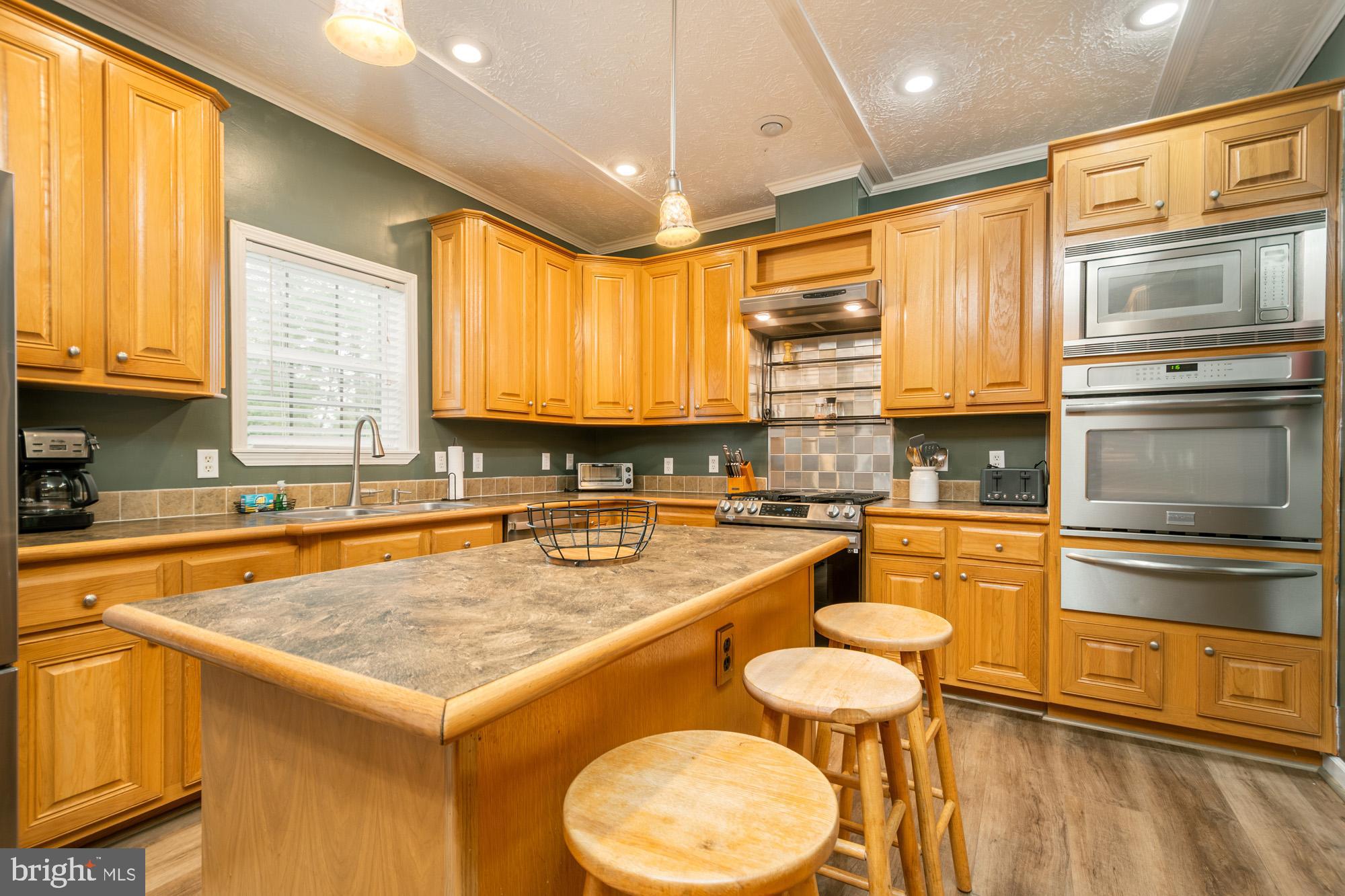 2228 Hoyes Run Road McHenry, MD 21541 - Photo 1 of 52 a kitchen with a stove a sink and a refrigerator