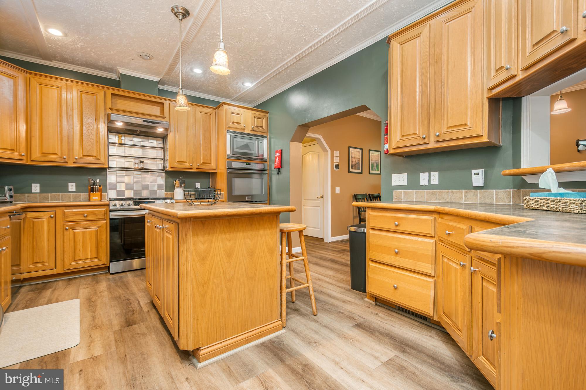 2228 Hoyes Run Road McHenry, MD 21541 - Photo 23 of 52 a kitchen with stainless steel appliances granite countertop a sink a stove and a refrigerator