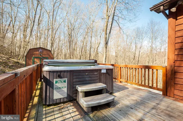 a living room with furniture a dining table and a large window