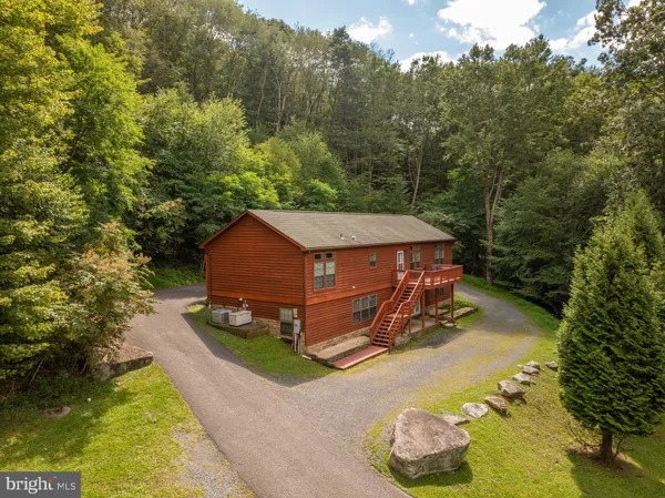a aerial view of a house with backyard