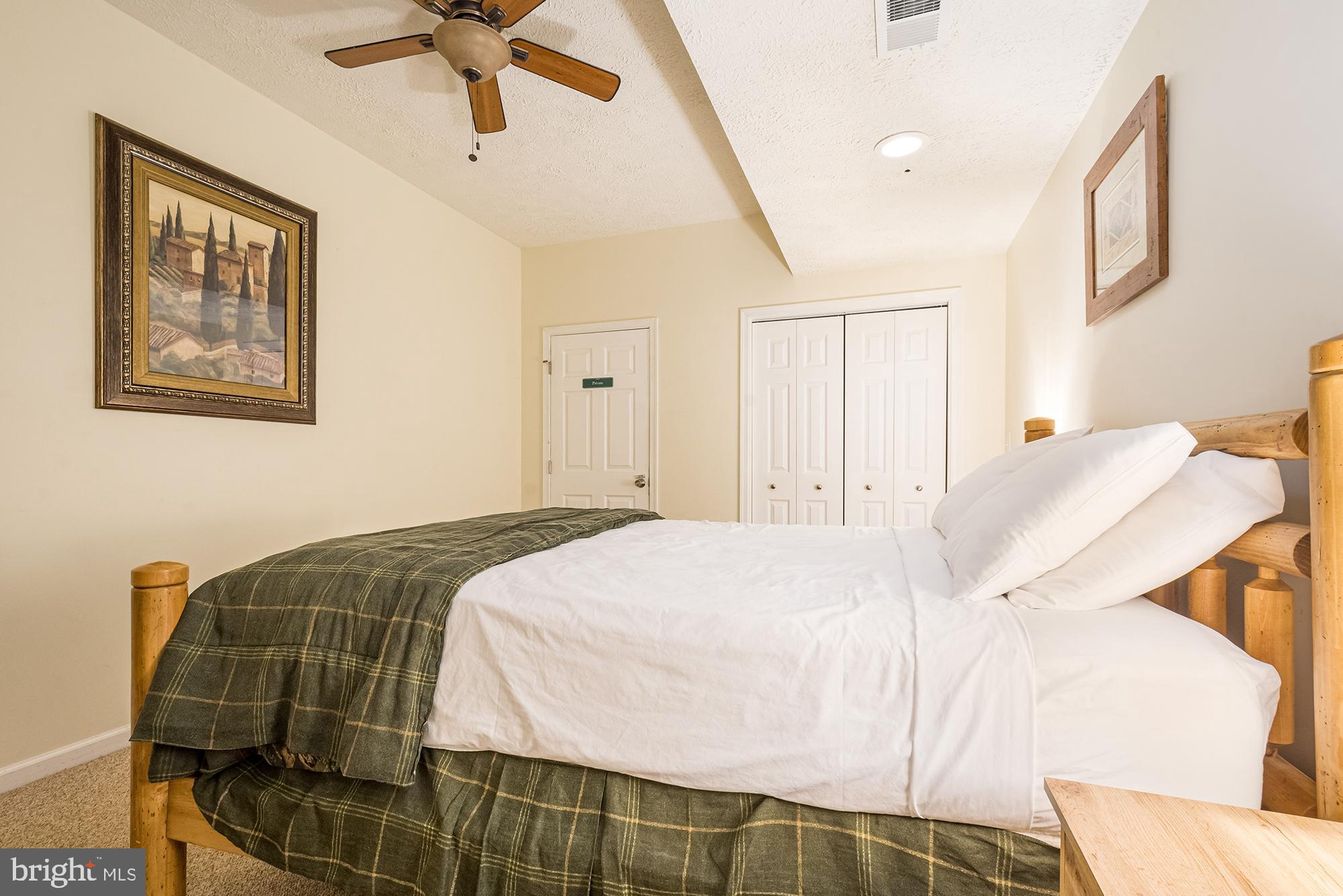 2228 Hoyes Run Road McHenry, MD 21541 - Photo 32 of 52 a bedroom with a bed and window