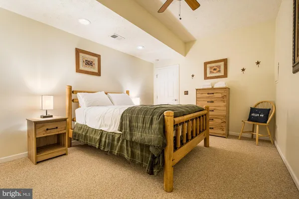 a bathroom with a sink a toilet and shower curtain