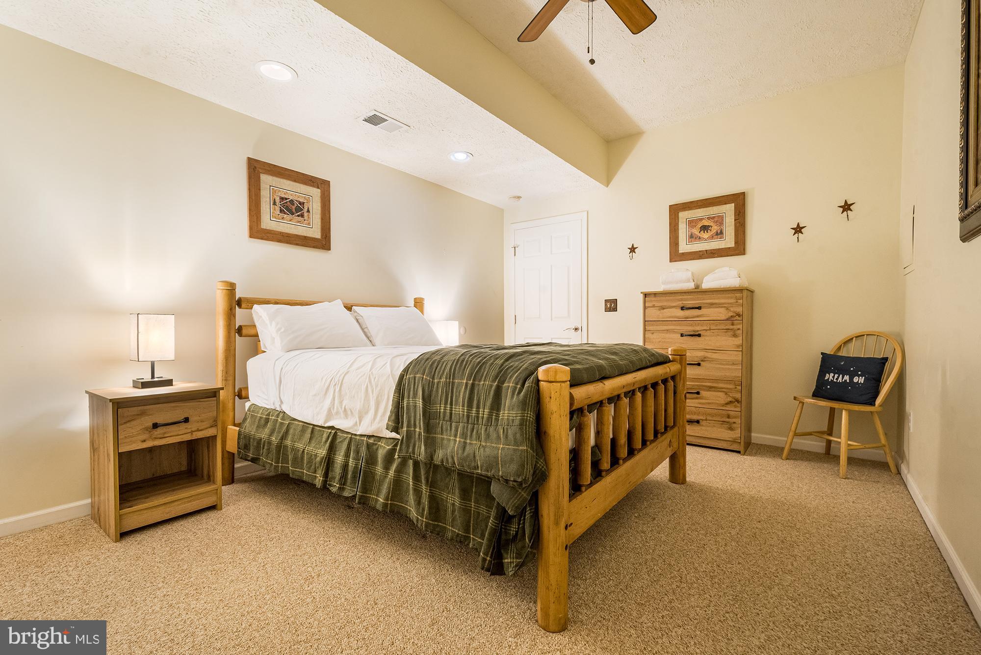 2228 Hoyes Run Road McHenry, MD 21541 - Photo 33 of 52 a bedroom with a bed and dresser