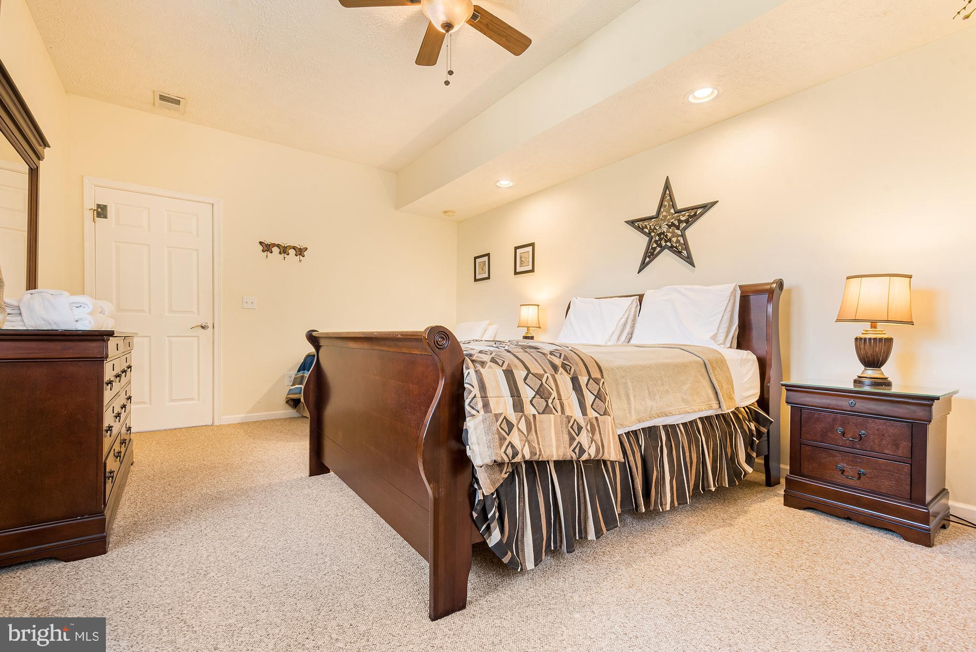 2228 Hoyes Run Road McHenry, MD 21541 - Photo 38 of 52 a bedroom with a bed and a chandelier