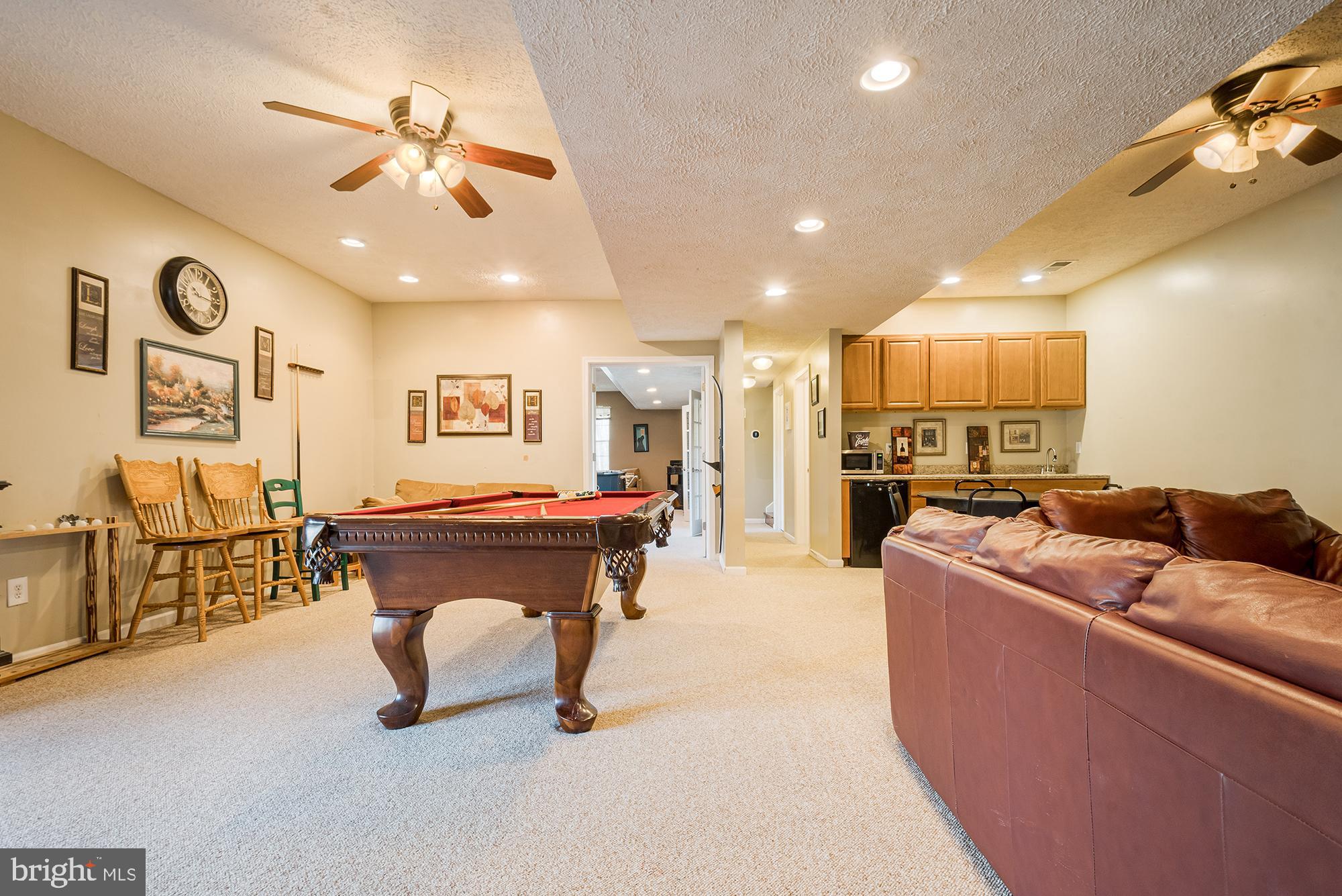 2228 Hoyes Run Road McHenry, MD 21541 - Photo 47 of 52 a living room with furniture and a chandelier