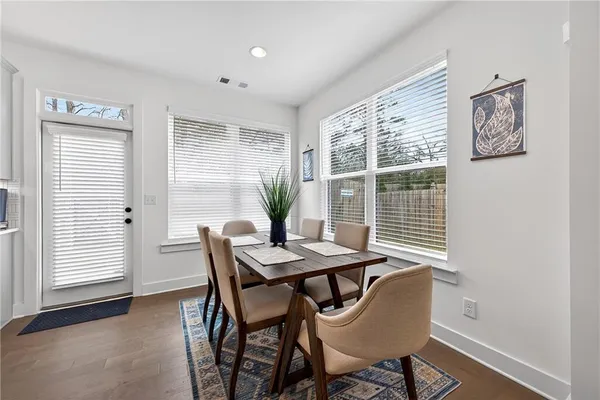 a view of a dining room with furniture and window