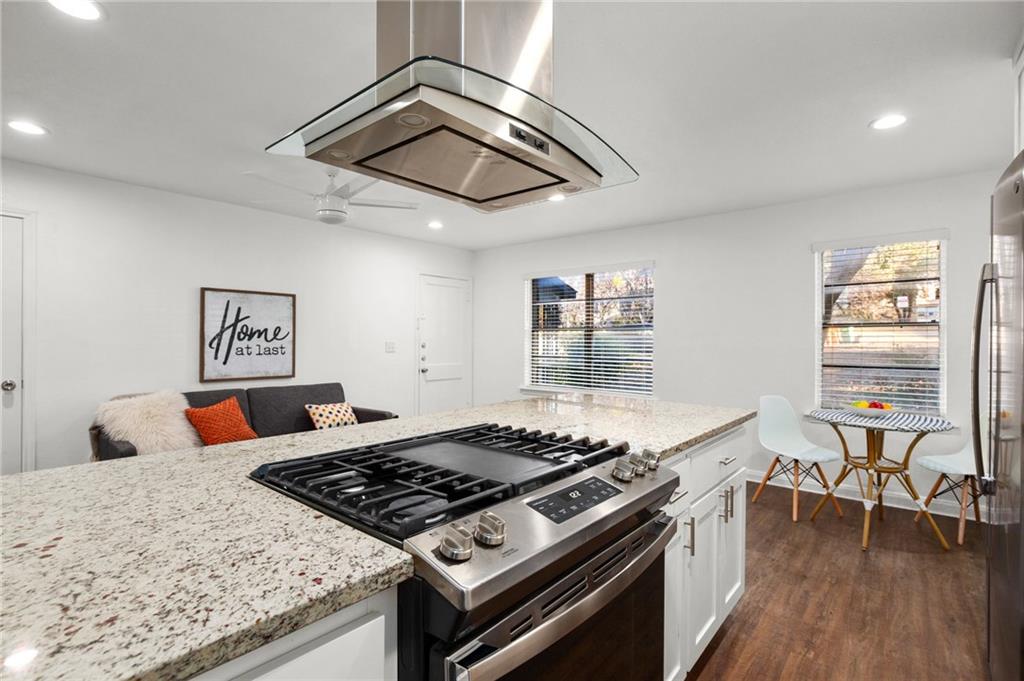 301 East 33rd Street, Unit 2 Austin, TX 78705 - Photo 5 of 9 a stove top oven sitting inside of a kitchen