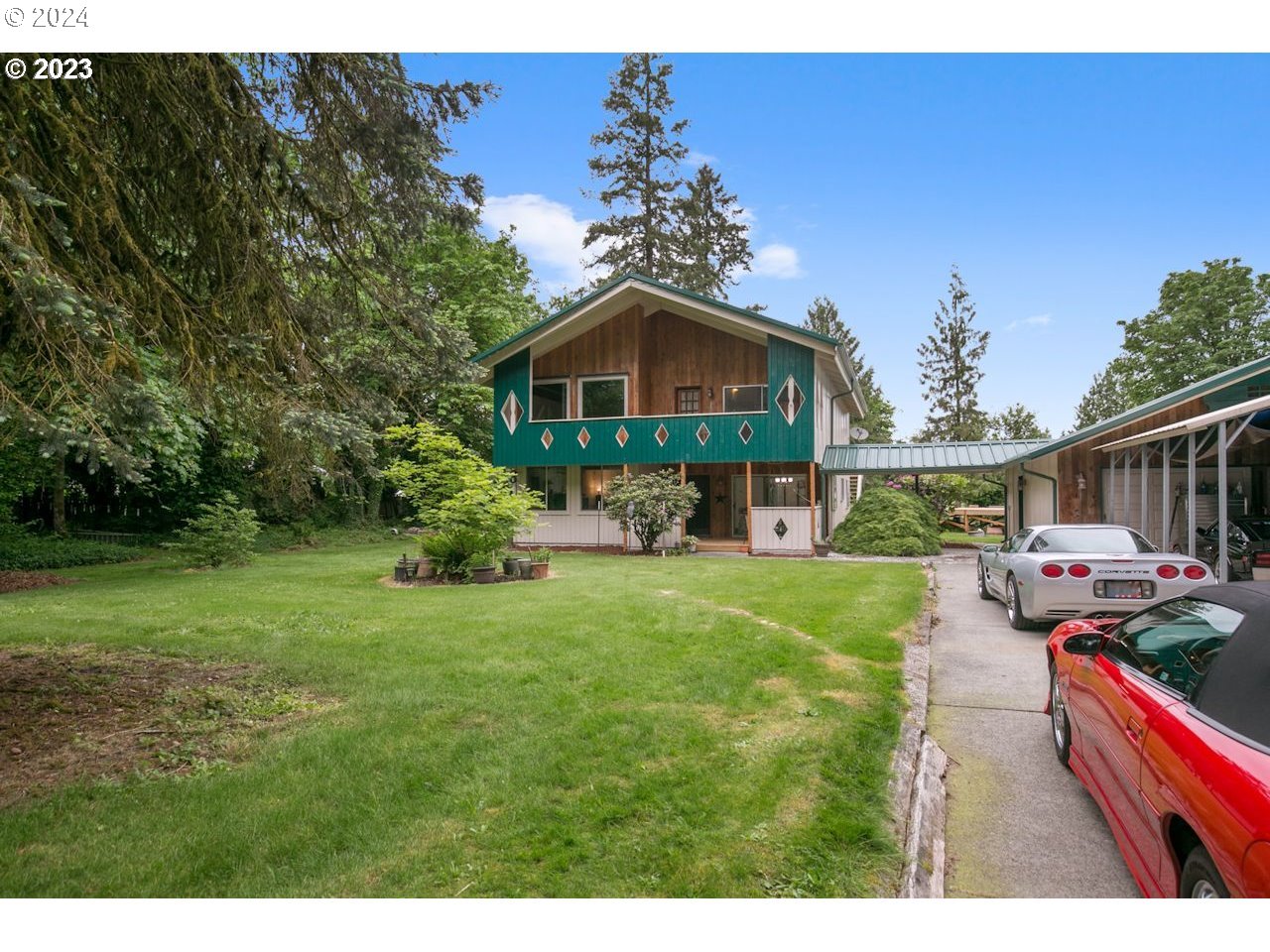 3318 Northwest 203rd Street Ridgefield, WA 98642 - Photo 1 of 28 a front view of a house with a yard
