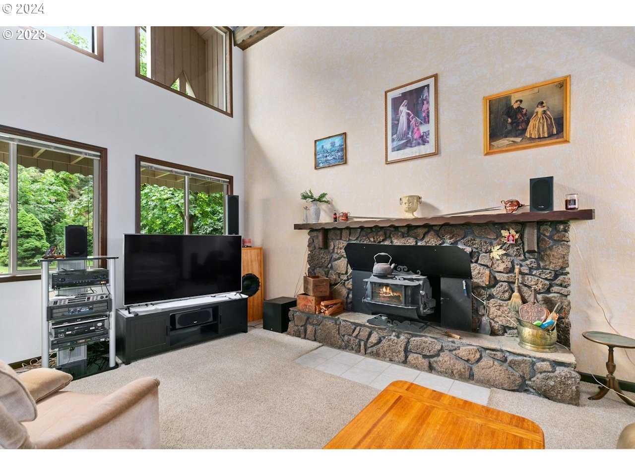 3318 Northwest 203rd Street Ridgefield, WA 98642 - Photo 11 of 28 a living room with furniture and a flat screen tv