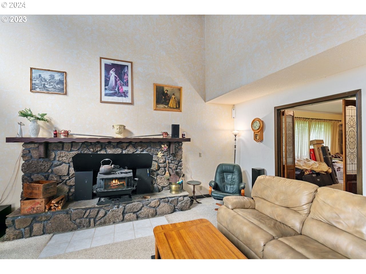3318 Northwest 203rd Street Ridgefield, WA 98642 - Photo 13 of 28 a living room with furniture and a fireplace