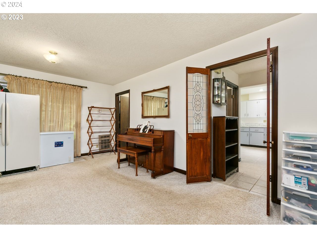 3318 Northwest 203rd Street Ridgefield, WA 98642 - Photo 16 of 28 a living room with furniture a desk and closet