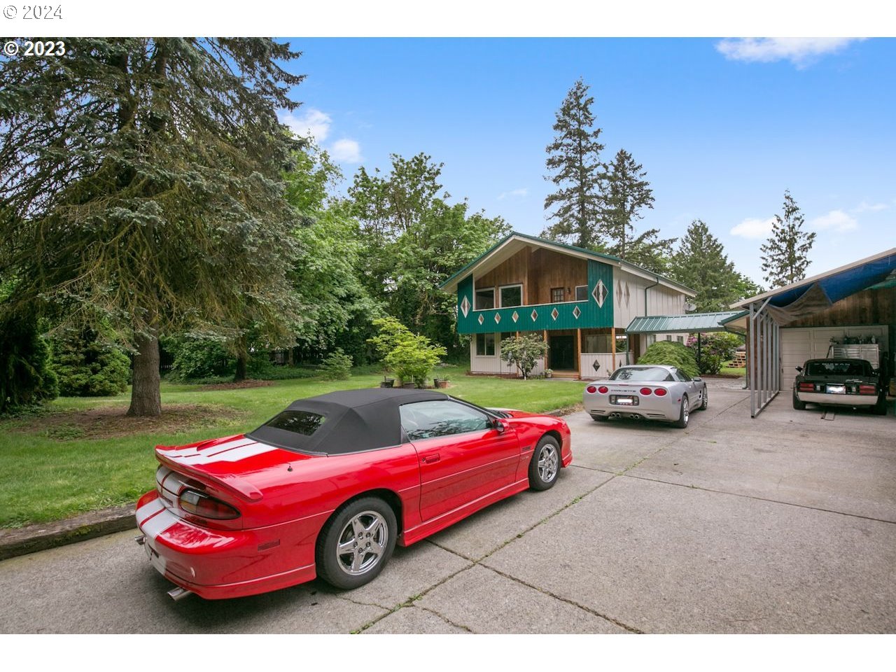 3318 Northwest 203rd Street Ridgefield, WA 98642 - Photo 2 of 28 a front view of a house with a garden and parking space