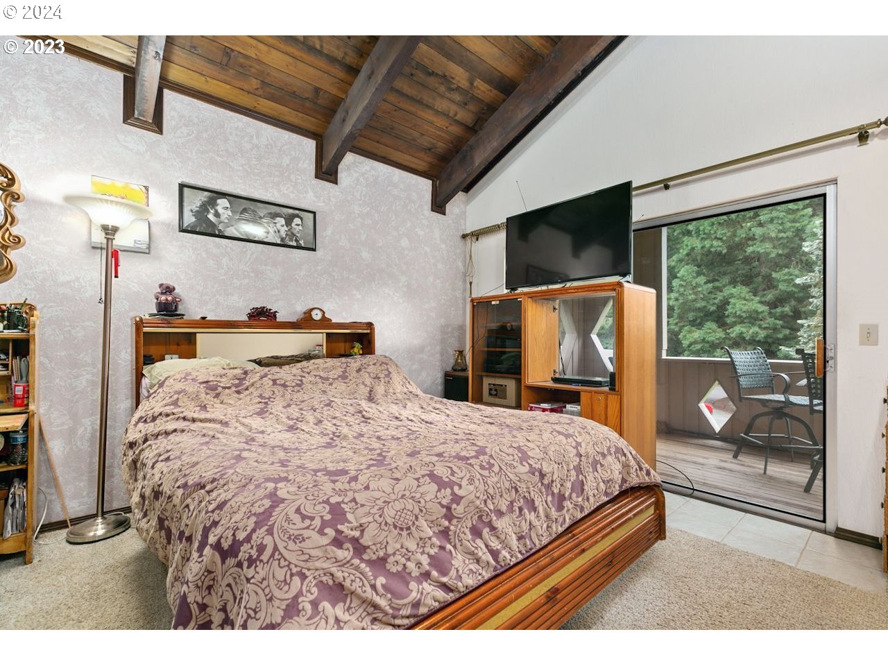 3318 Northwest 203rd Street Ridgefield, WA 98642 - Photo 23 of 28 a bedroom with a bed and wooden floor