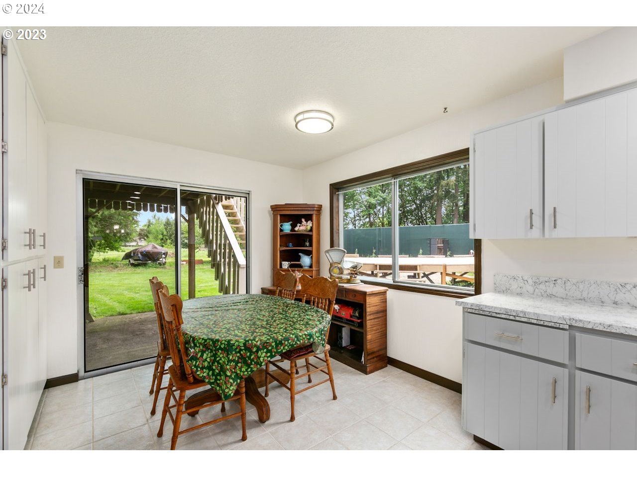 3318 Northwest 203rd Street Ridgefield, WA 98642 - Photo 5 of 28 a kitchen with a table chairs and a stove