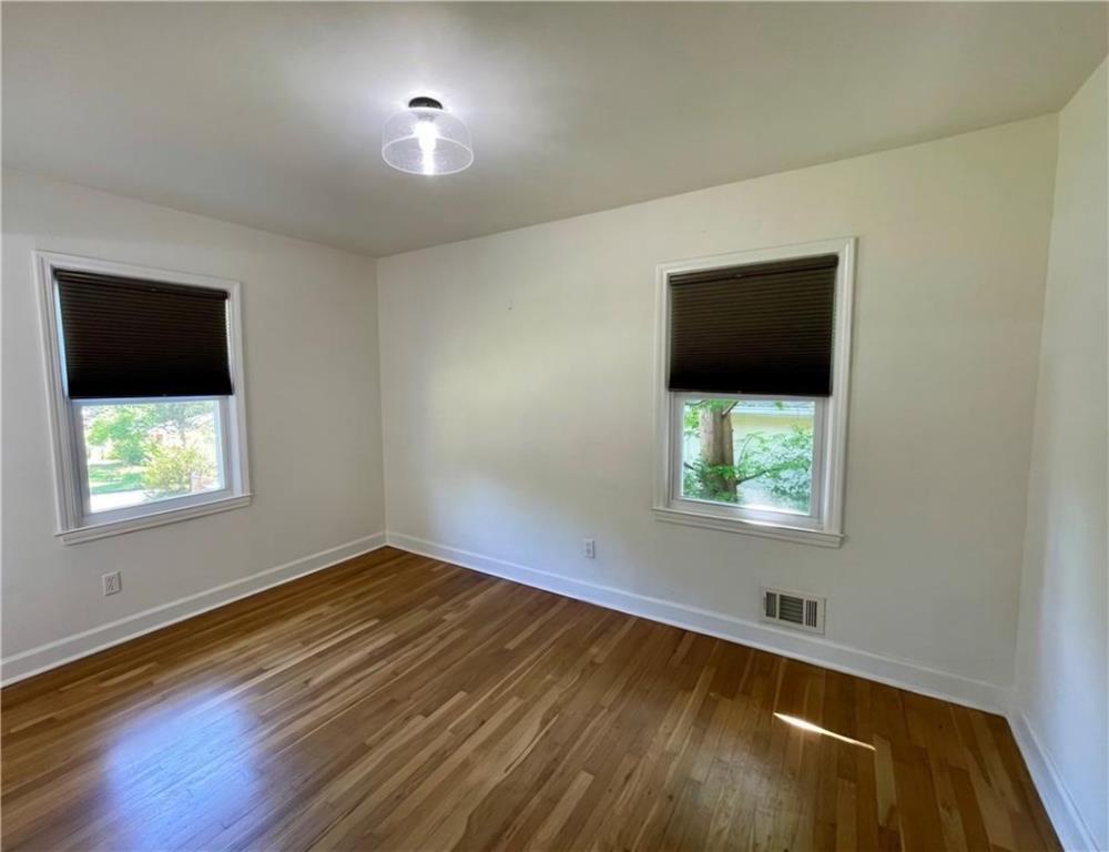 2682 Pineland Avenue Atlanta, GA 30340 - Photo 2 of 11 en empty room with window and wooden floor