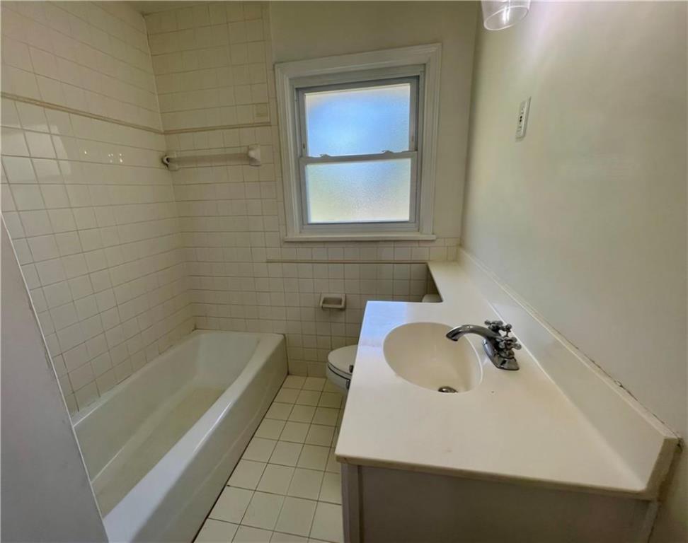 2682 Pineland Avenue Atlanta, GA 30340 - Photo 5 of 11 a bathroom with a sink a bathtub and a shower