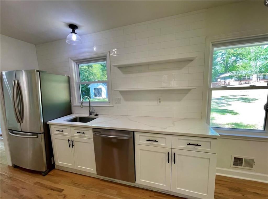 2682 Pineland Avenue Atlanta, GA 30340 - Photo 10 of 11 a kitchen with a sink a refrigerator and window