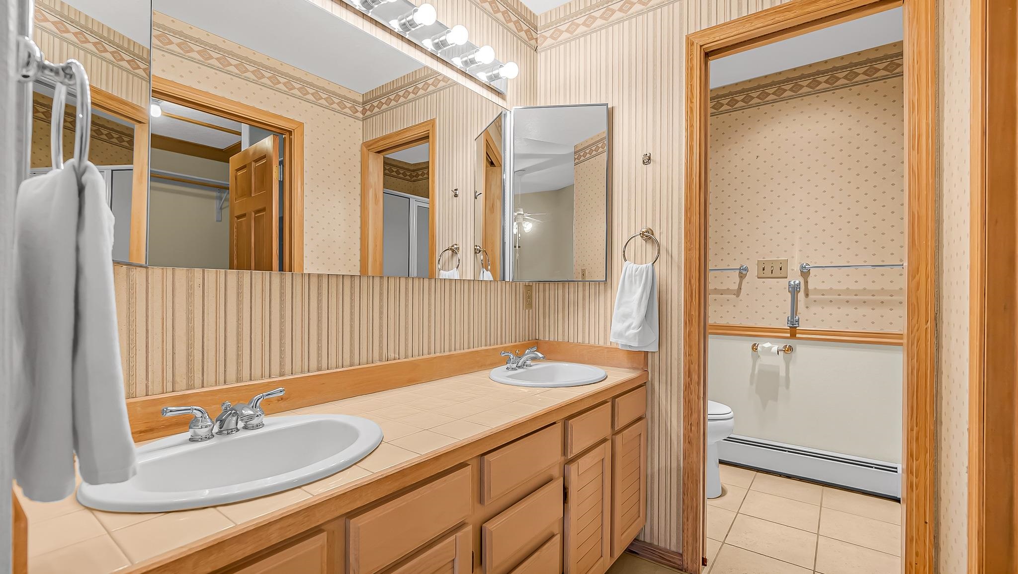 12 West Ridge Court Parachute, CO 81635 - Photo 13 of 37 a bathroom with a sink and a mirror