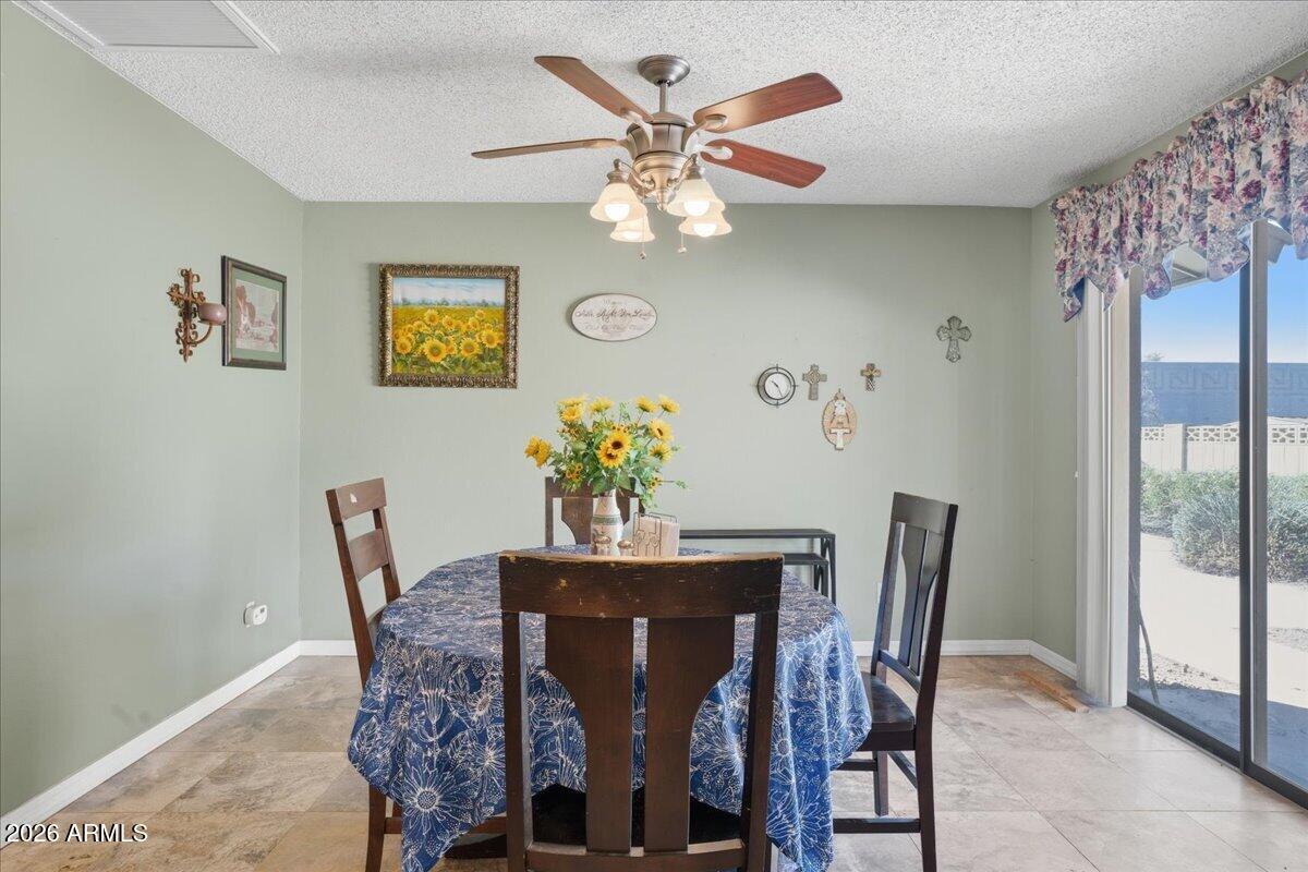 3922 South Poplar Street Tempe, AZ 85282 - Photo 12 of 41 a dining room with furniture and chandelier