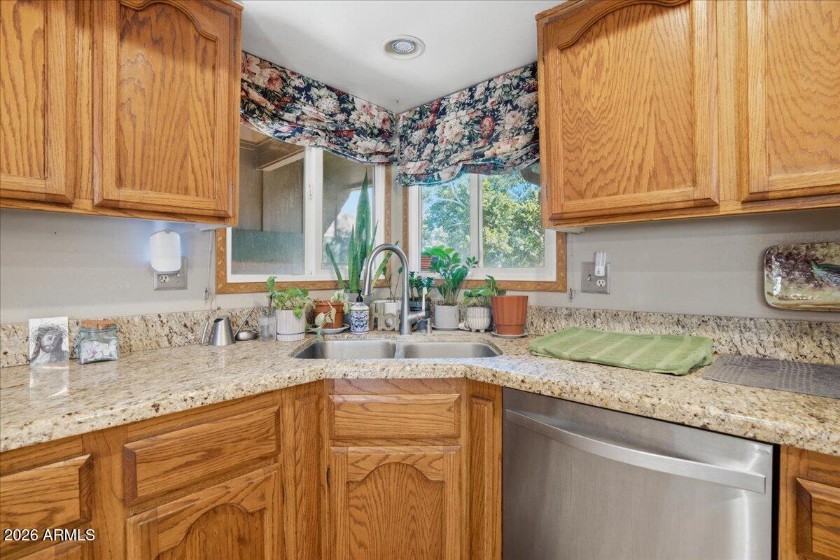 3922 South Poplar Street Tempe, AZ 85282 - Photo 16 of 41 a kitchen with sink and cabinets