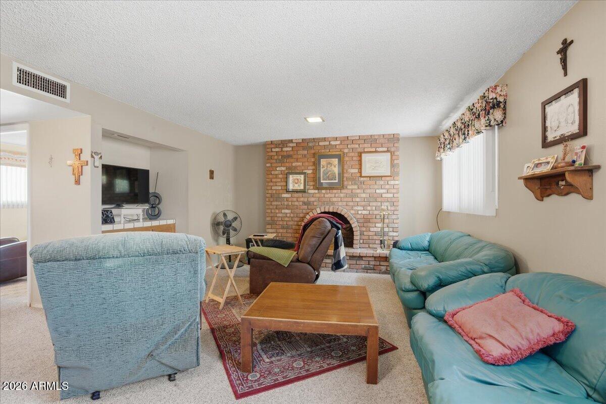 3922 South Poplar Street Tempe, AZ 85282 - Photo 21 of 41 a living room with furniture and a flat screen tv
