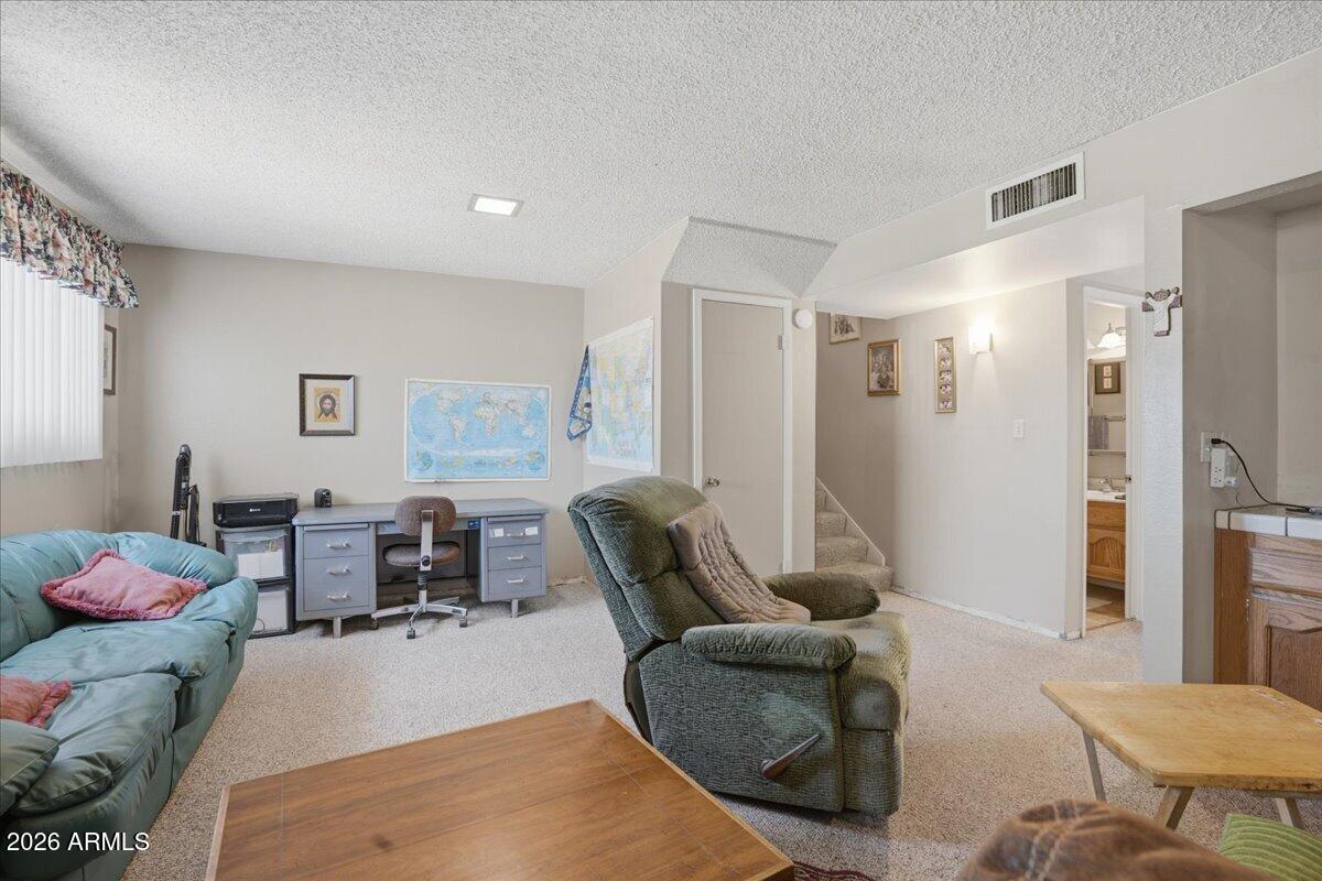 3922 South Poplar Street Tempe, AZ 85282 - Photo 22 of 41 a living room with furniture and a table