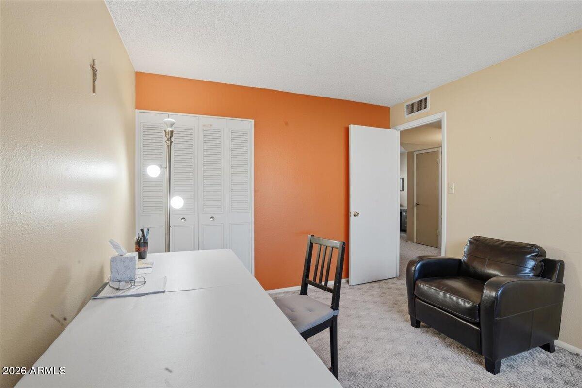 3922 South Poplar Street Tempe, AZ 85282 - Photo 26 of 41 a living room with furniture and a wooden floor