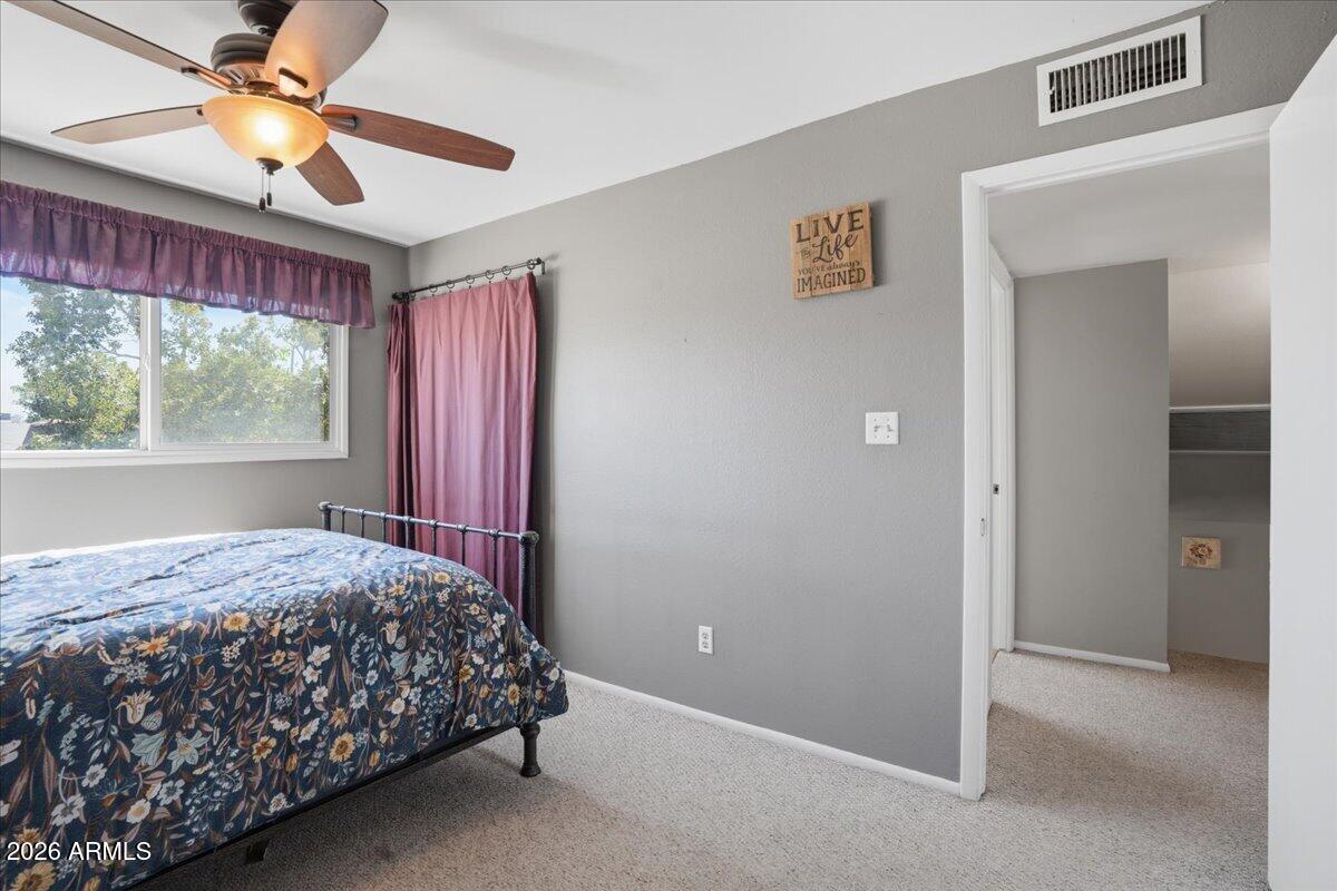 3922 South Poplar Street Tempe, AZ 85282 - Photo 29 of 41 a bedroom with a bed and a window