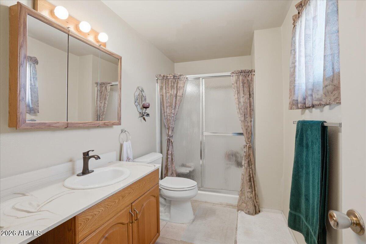 3922 South Poplar Street Tempe, AZ 85282 - Photo 36 of 41 a bathroom with a sink toilet and shower