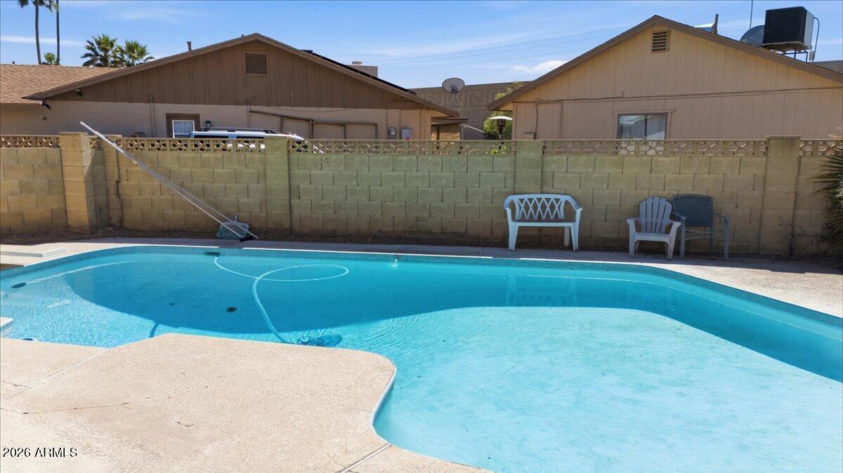 3922 South Poplar Street Tempe, AZ 85282 - Photo 37 of 41 a backyard of a house with table and chairs