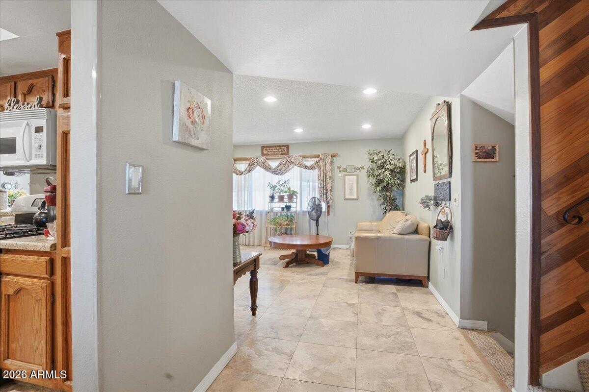 3922 South Poplar Street Tempe, AZ 85282 - Photo 5 of 41 a living room with furniture and a large window
