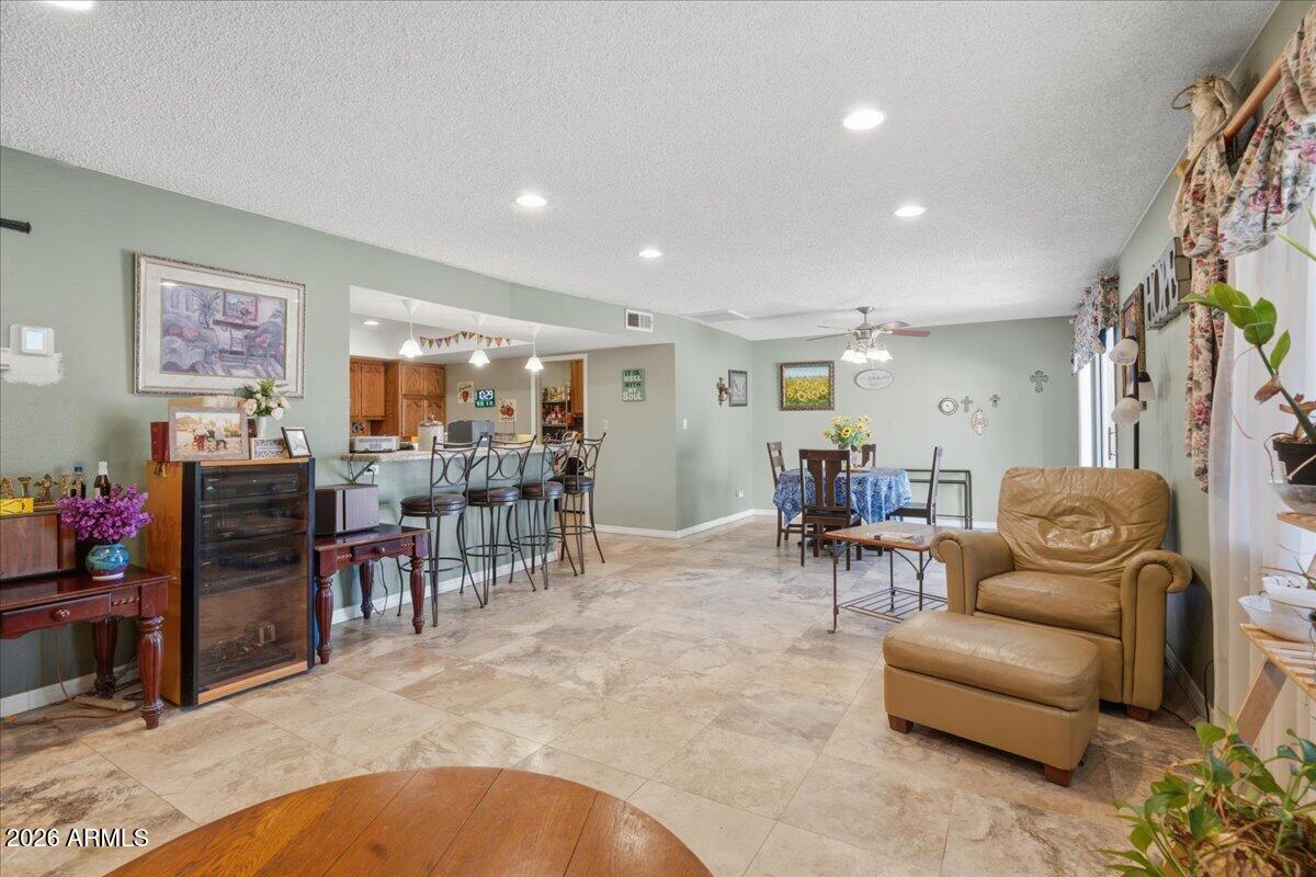 3922 South Poplar Street Tempe, AZ 85282 - Photo 7 of 41 a living room with furniture and a flat screen tv