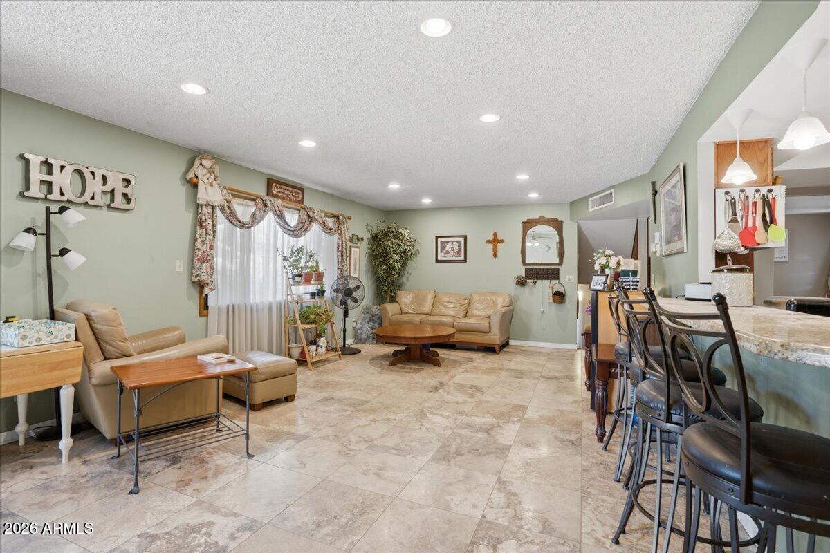 3922 South Poplar Street Tempe, AZ 85282 - Photo 8 of 41 a living room with furniture and a flat screen tv