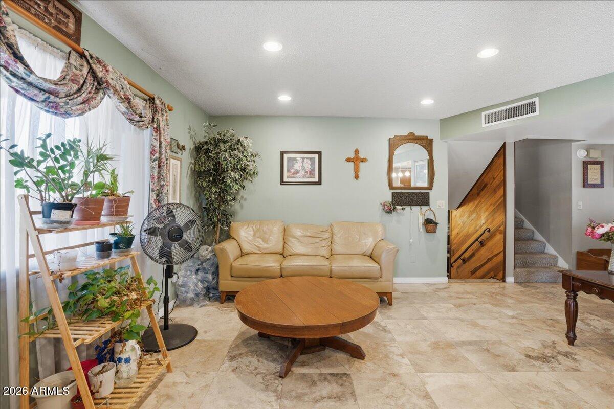 3922 South Poplar Street Tempe, AZ 85282 - Photo 10 of 41 a living room with furniture and a flat screen tv