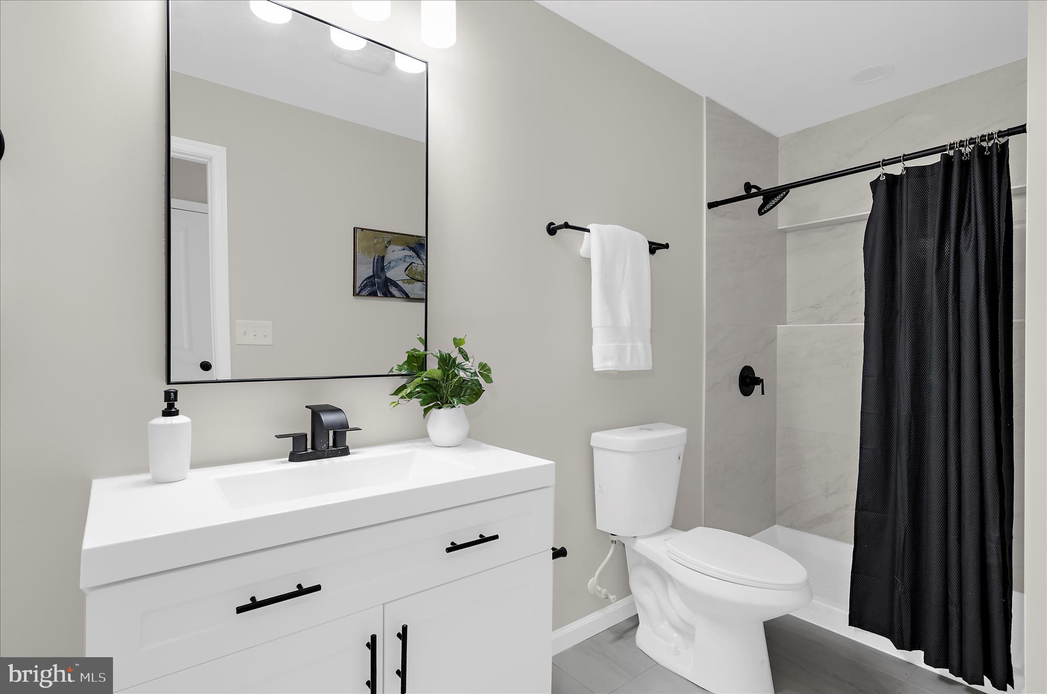 222 Doncaster Road Joppa, MD 21085 - Photo 17 of 41 a bathroom with a sink toilet and shower