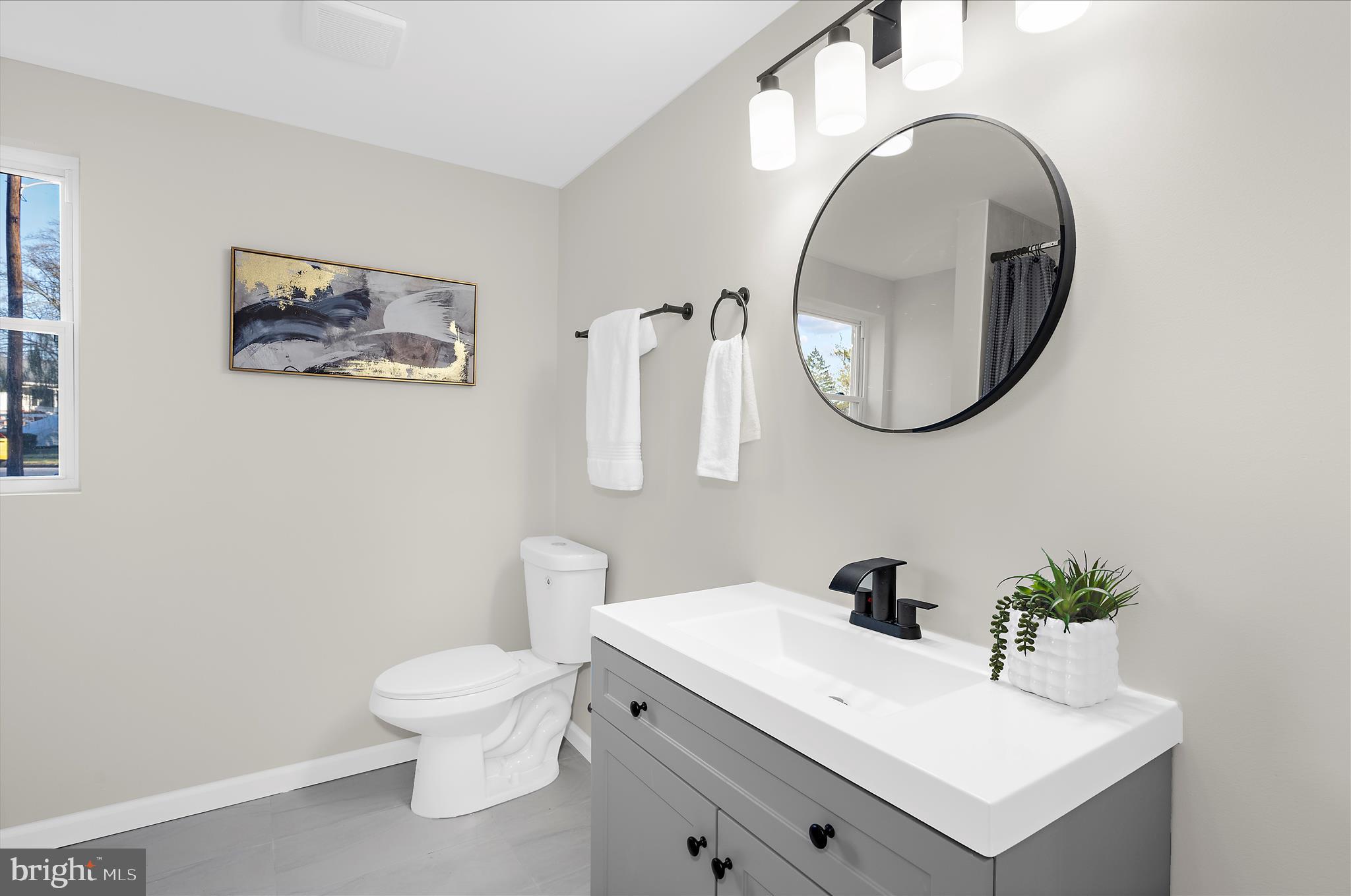 222 Doncaster Road Joppa, MD 21085 - Photo 29 of 41 a white toilet sitting next to a bathroom sink