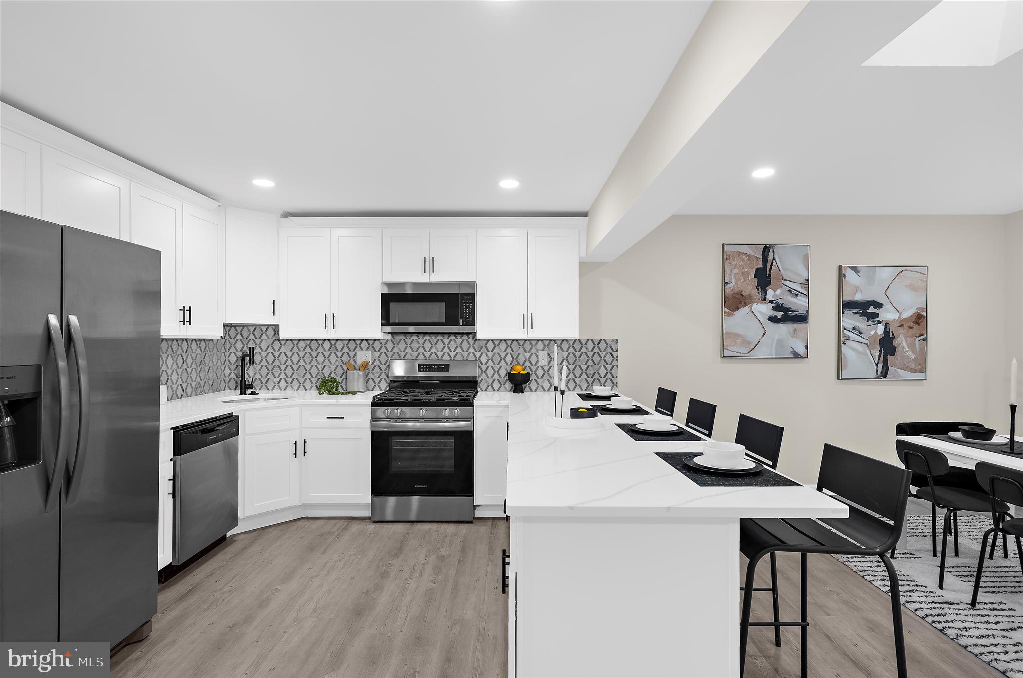 222 Doncaster Road Joppa, MD 21085 - Photo 6 of 41 a kitchen that has a lot of cabinets a sink and a refrigerator in it