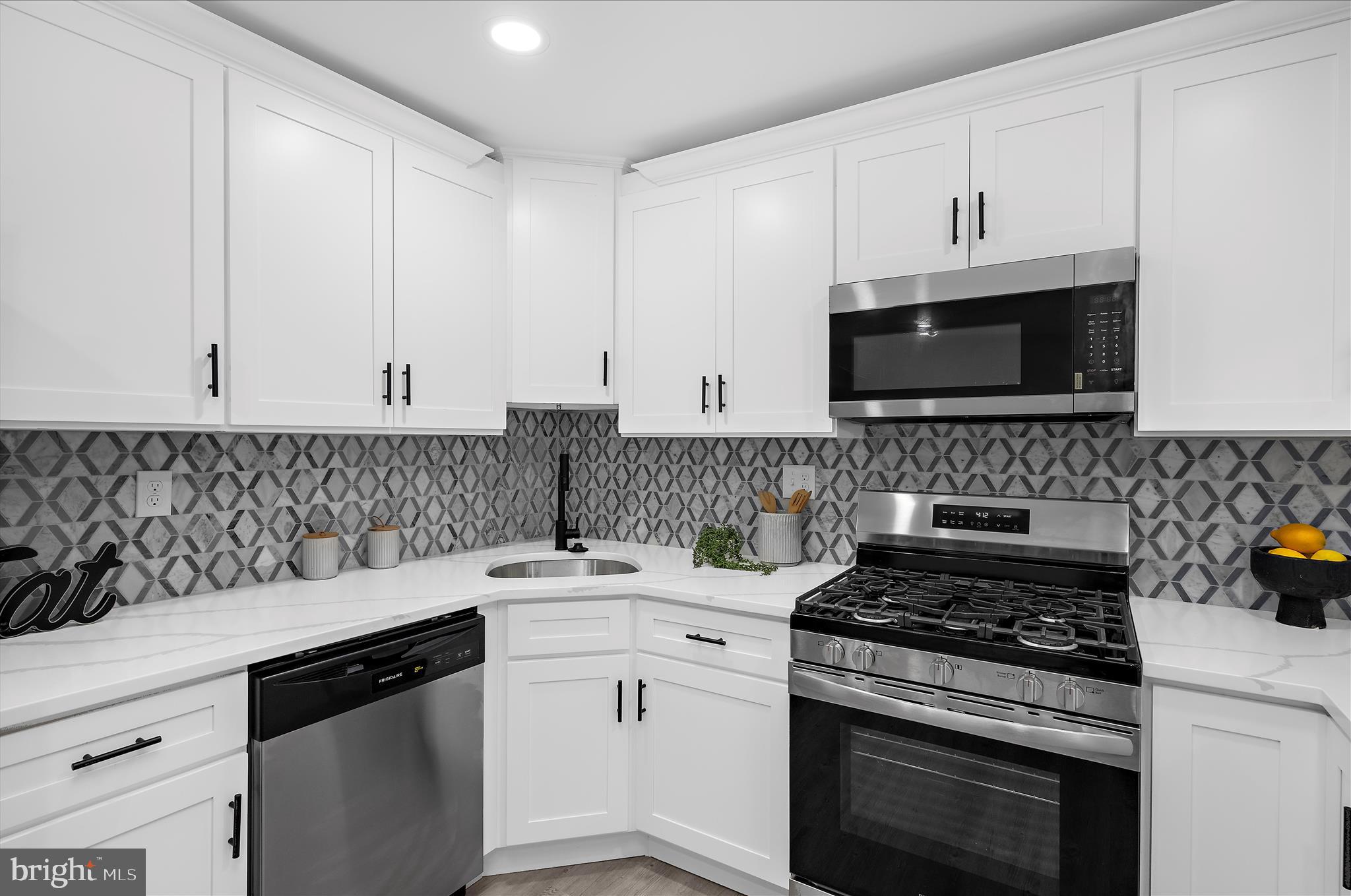 222 Doncaster Road Joppa, MD 21085 - Photo 8 of 41 a kitchen with appliances a sink and cabinets