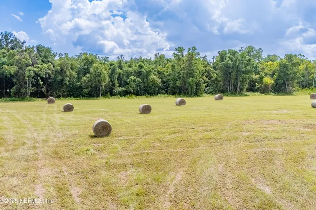 a view of a pool with a yard