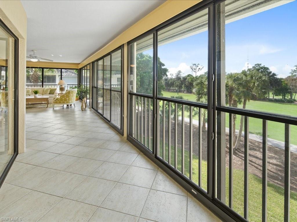 770 Eagle Creek Drive, Unit 301 Naples, FL 34113 - Photo 12 of 46 a view of a floor to ceiling window with a yard