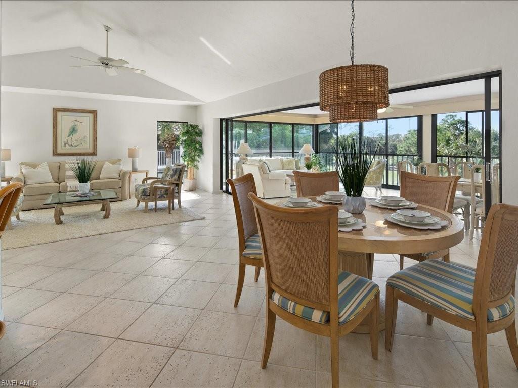 770 Eagle Creek Drive, Unit 301 Naples, FL 34113 - Photo 16 of 46 a view of a dining room with furniture window and outside view