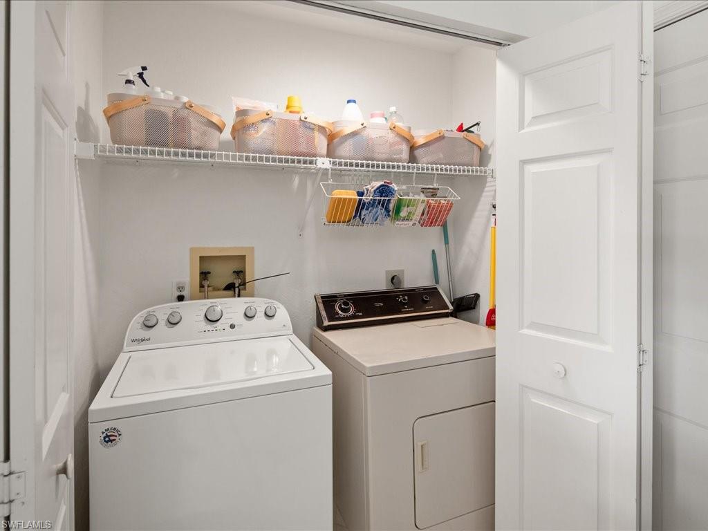 770 Eagle Creek Drive, Unit 301 Naples, FL 34113 - Photo 21 of 46 a utility room with dryer and washer