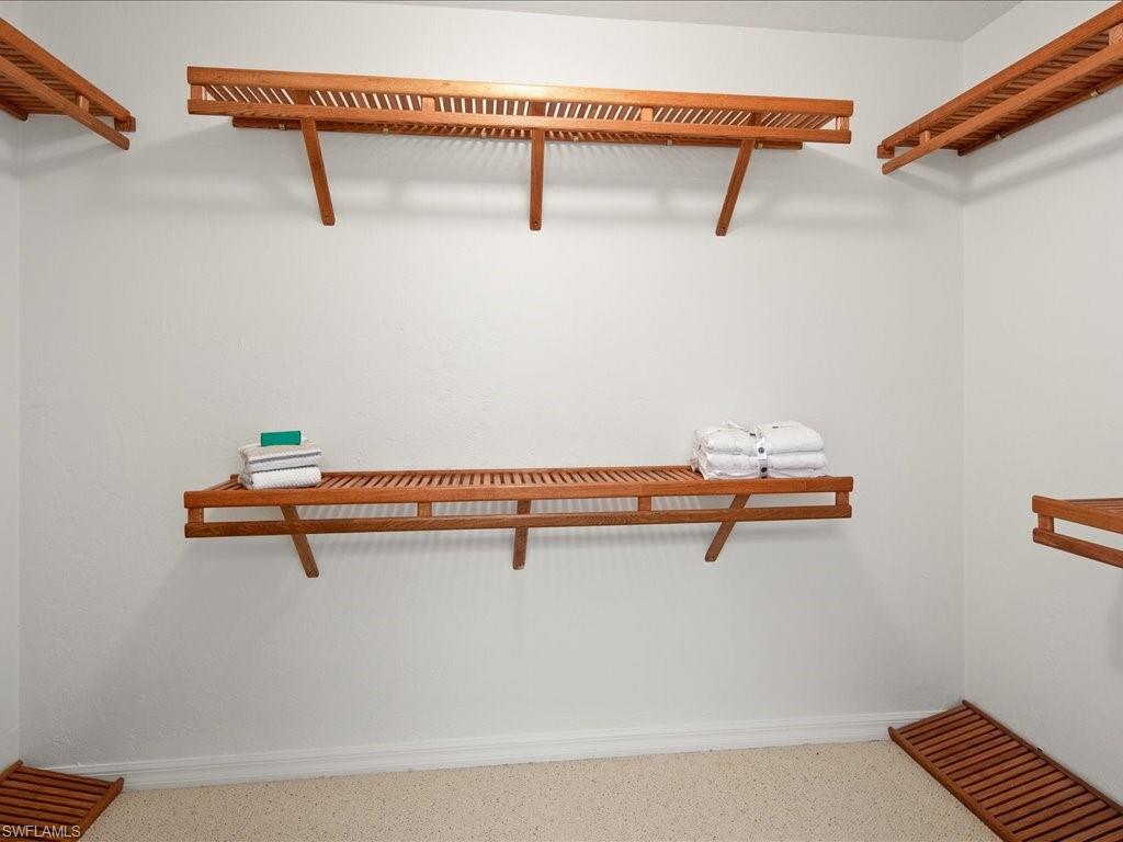 770 Eagle Creek Drive, Unit 301 Naples, FL 34113 - Photo 27 of 46 a view of a room with racks on the wall