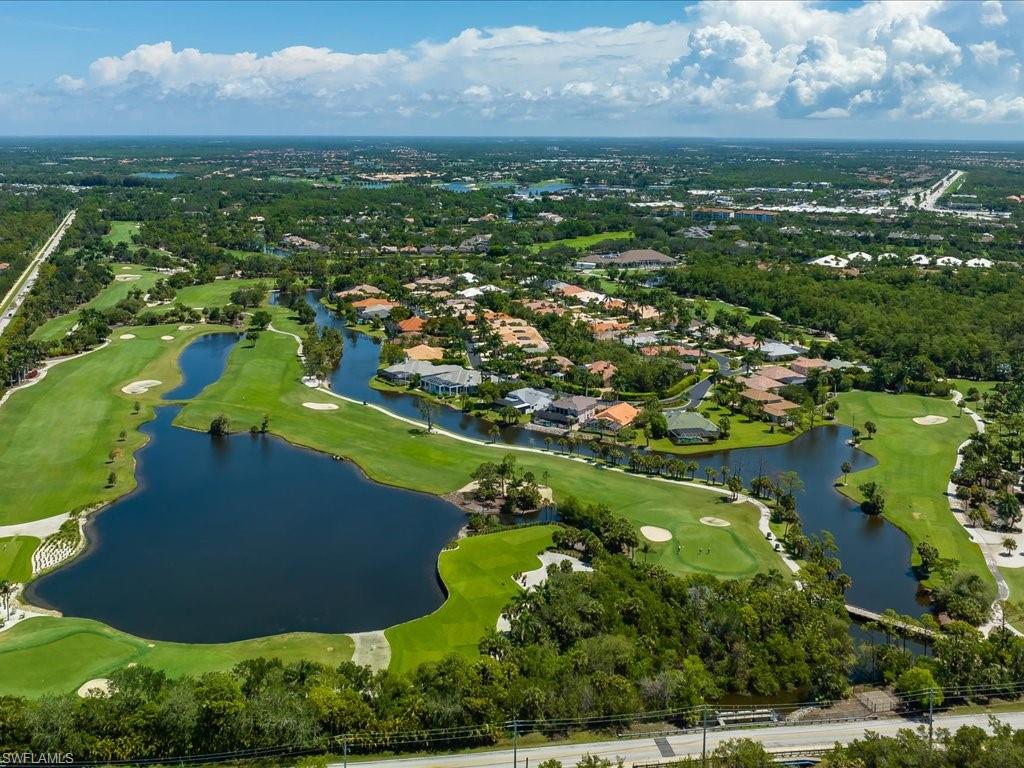 770 Eagle Creek Drive, Unit 301 Naples, FL 34113 - Photo 37 of 46 an aerial view of residential houses with outdoor space and lake view