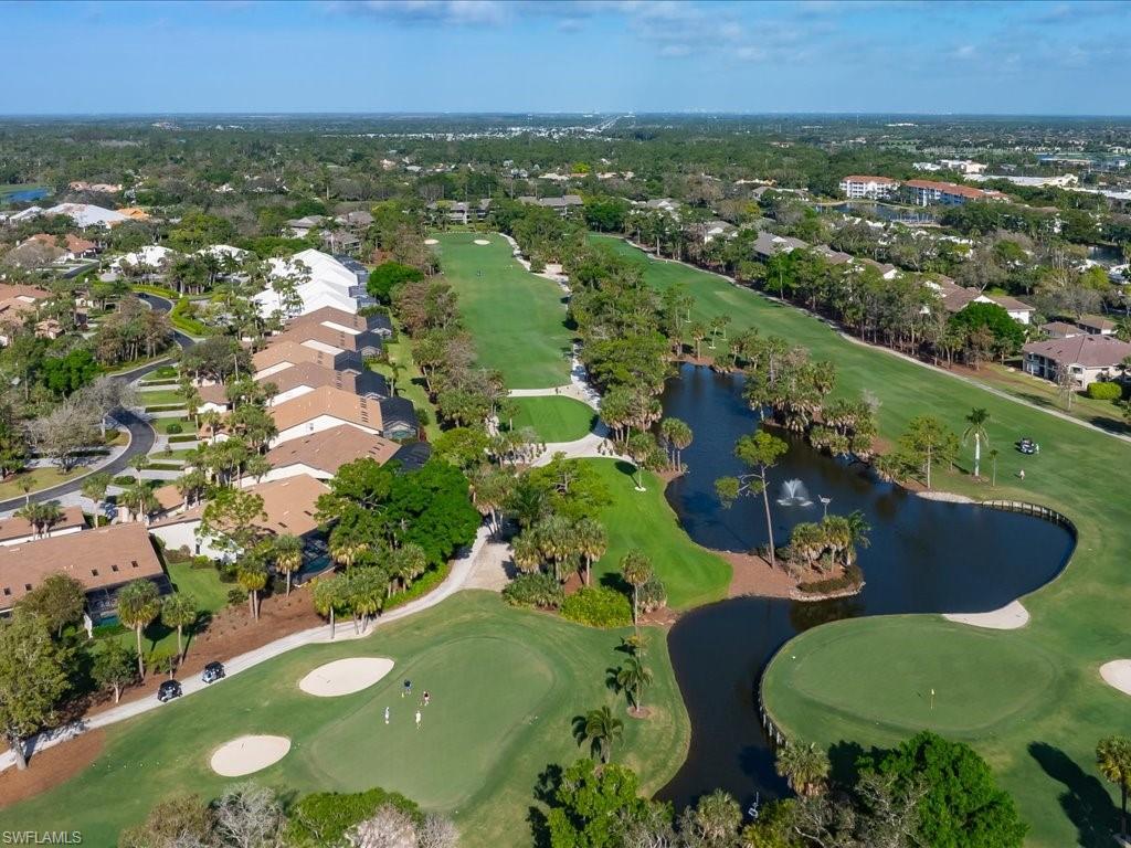 770 Eagle Creek Drive, Unit 301 Naples, FL 34113 - Photo 38 of 46 an aerial view of residential houses with outdoor space and a swimming pool