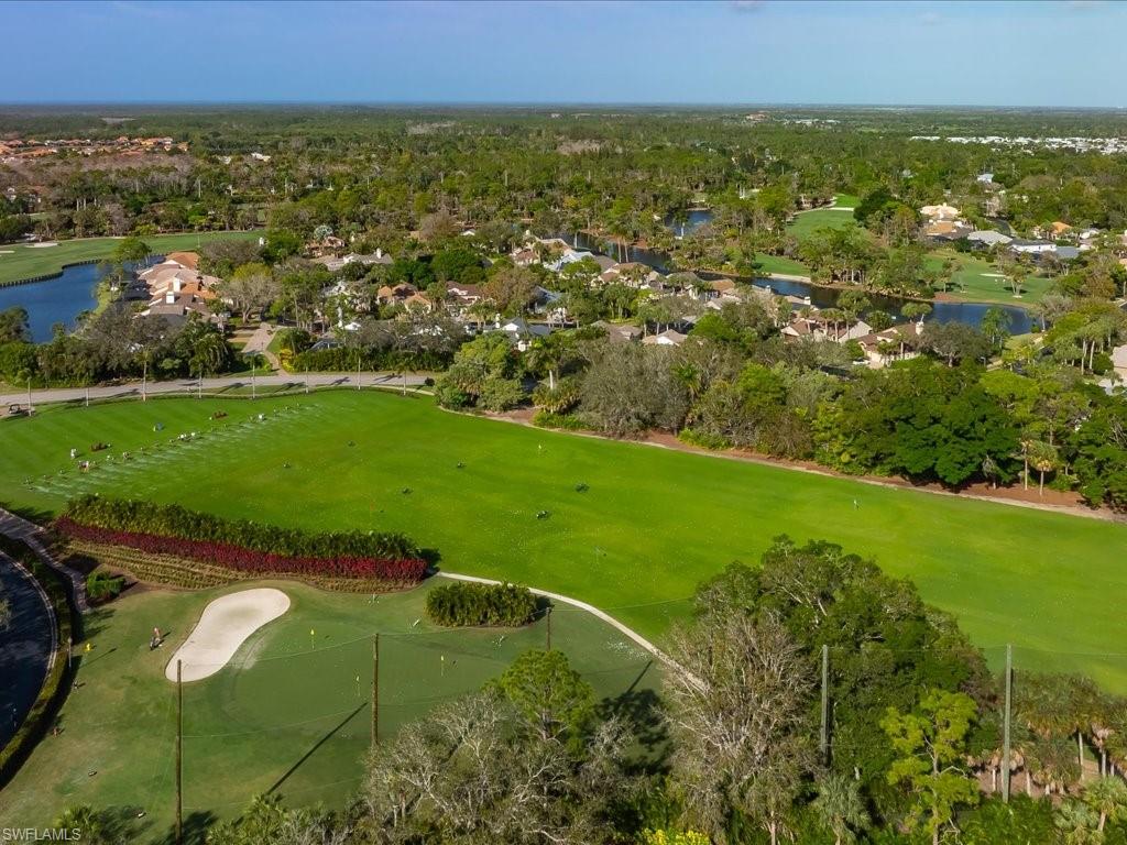 770 Eagle Creek Drive, Unit 301 Naples, FL 34113 - Photo 39 of 46 an aerial view of residential houses with outdoor space and trees