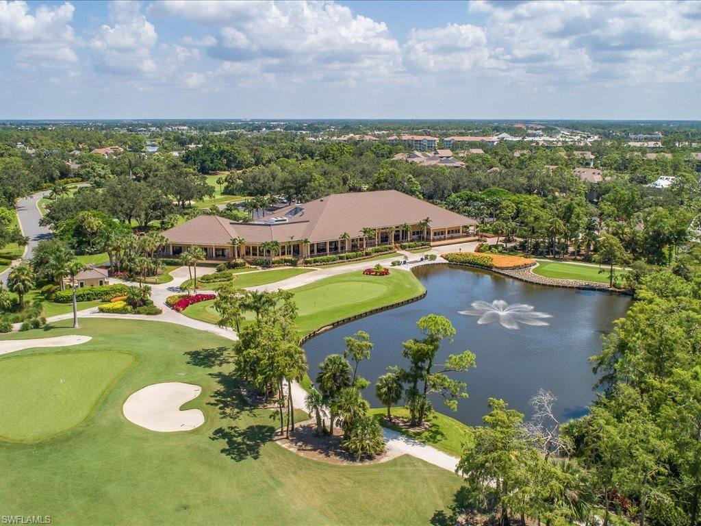 770 Eagle Creek Drive, Unit 301 Naples, FL 34113 - Photo 40 of 46 a view of a lake with a mountain