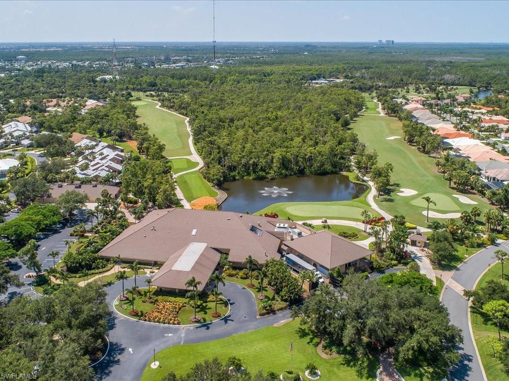 770 Eagle Creek Drive, Unit 301 Naples, FL 34113 - Photo 42 of 46 an aerial view of residential houses with outdoor space and river