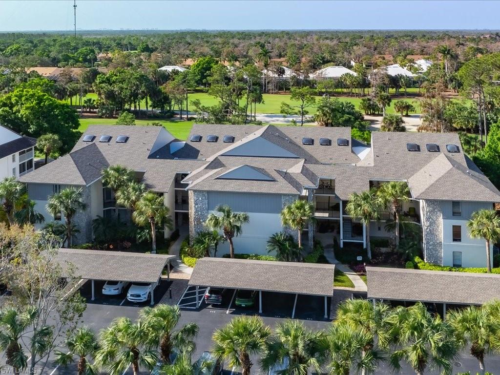 770 Eagle Creek Drive, Unit 301 Naples, FL 34113 - Photo 43 of 46 an aerial view of a house with a garden